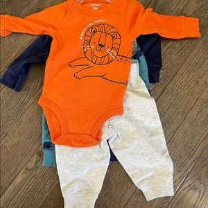 Carter’s four piece set. Two pairs of sweatpants and two long sleeve tees